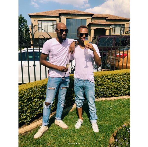 South African gay media personality, ?Somizi shows off his man as they step out in matching outfits (Photos)