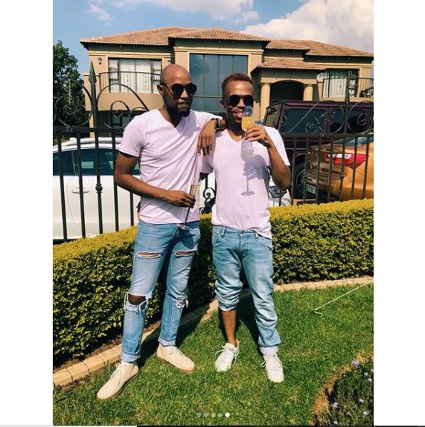 South African gay media personality, ?Somizi shows off his man as they step out in matching outfits (Photos)