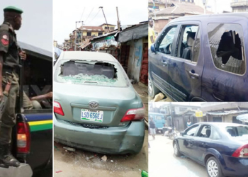 Policeman, Vandalised vehicles at Idi-Oro, Mushin area of Lagos