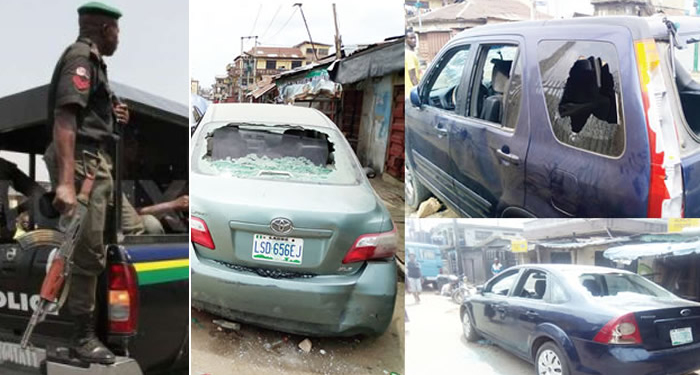 Policeman, Vandalised vehicles at Idi-Oro, Mushin area of Lagos