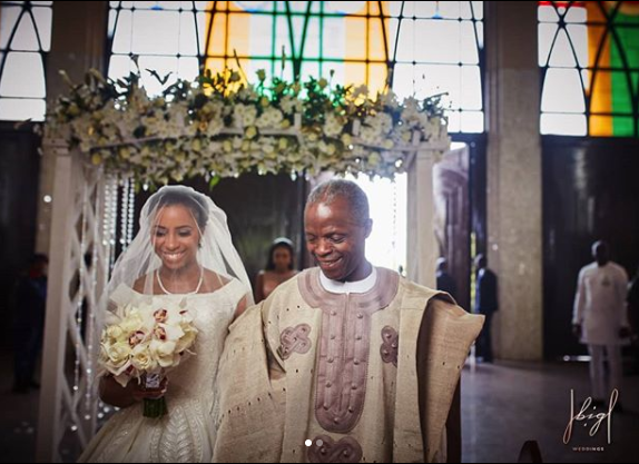 Lovely photos of VP Yemi Osinbajo walking his daughter down the aisle at her wedding in Abuja today