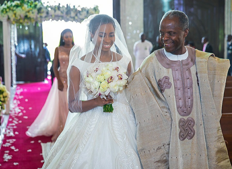 Lovely photos of VP Yemi Osinbajo walking his daughter down the aisle at her wedding in Abuja today