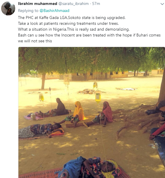 Shocking photo of ailing Sokoto state residents receiving drip under a tree at a public health center
