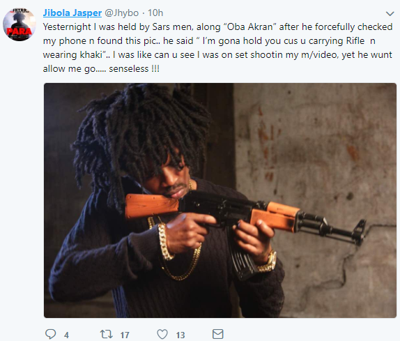 Nigerian artist Jhybo detained by SARS officers after a photo of him holding a rifle was found on his phone