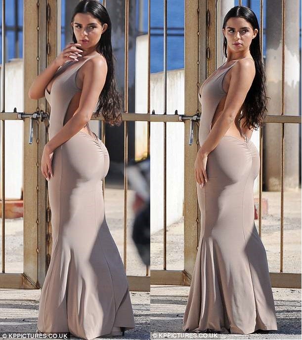 Demi Rose flaunts serious sideboob and curves in figure-hugging nude dress? (Photos)