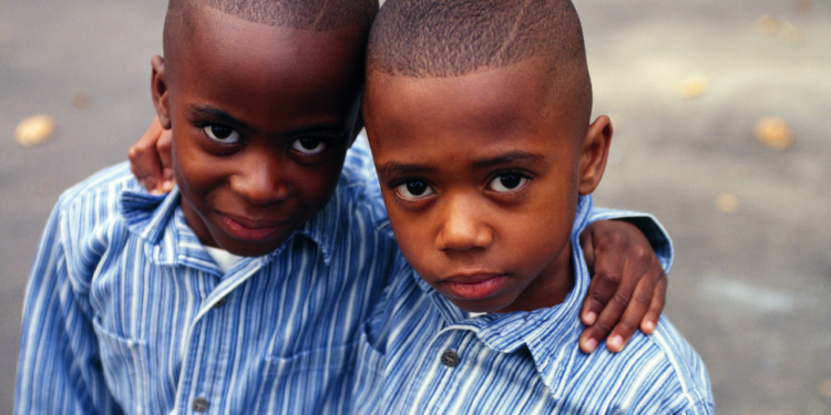 Brothers Arm in Arm --- Image by © Royalty-Free/Corbis