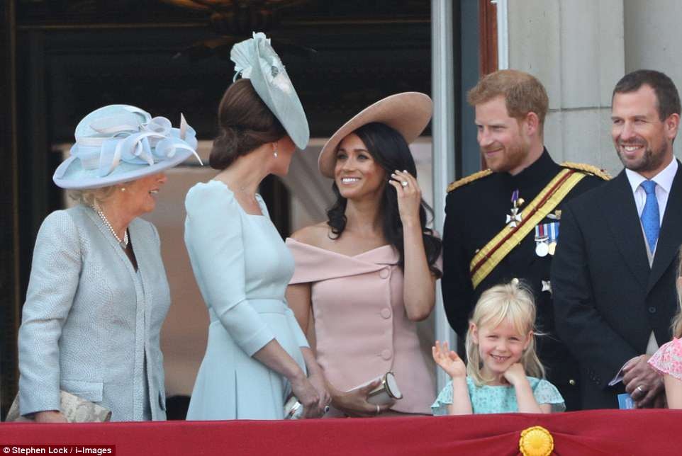 Meghan makes her first balcony appearance at Buckingham Palace as she joins the Queen to celebrate her official 92nd birthday (Photos)