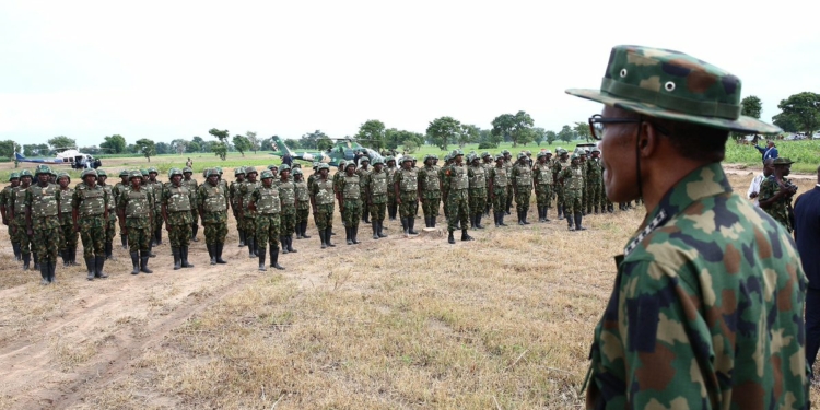 President Muhammadu Buhari spending time with troops of HQ 1 Brigade, to mark the Nigerian Army Day"