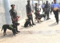 Nigeria Police inspecting security dogs