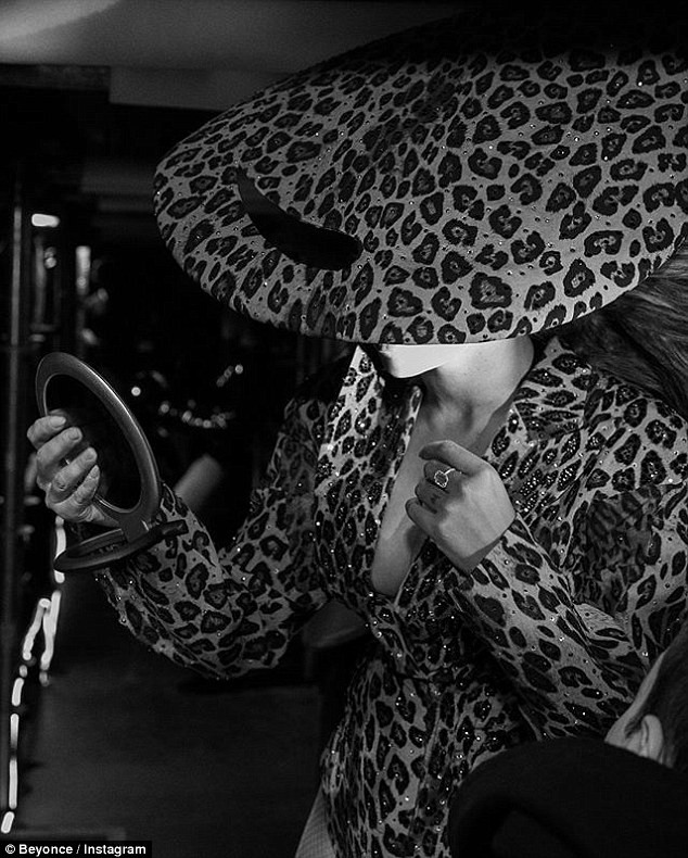 Beyonce flaunts her long legs in fierce leopard print leotard and matching thigh-high boots in new photos