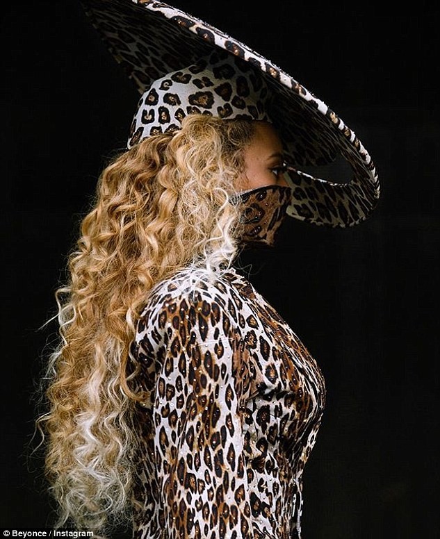 Beyonce flaunts her long legs in fierce leopard print leotard and matching thigh-high boots in new photos