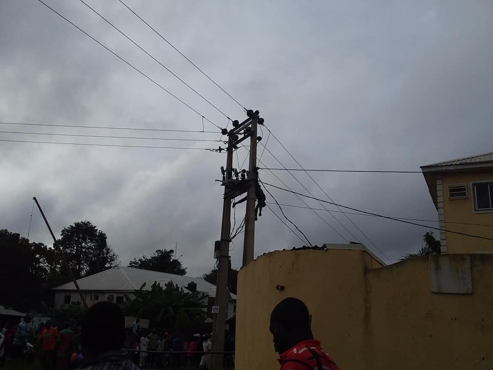 Graphic: Thief with charm in his mouth electrocuted while trying to steal copper in Abuja