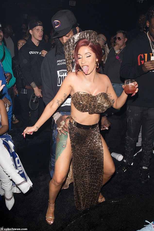 Cardi B rocks double split leopard print skirt as she seductively grinds on?husband Offset at her birthday night out (Photos)