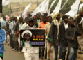 Nigeria Shiite Muslims hold religious flags and banners in a procession celebrating Prophet Muhammad’s birthday and also demanding the release of Shiite leader Ibraheem Zakzaky, on posters, in Kano, Nigeria, Thursday, Dec. 24, 2015.  The demonstration was in part provoked after a recent attack by Nigerian soldiers who fired on unarmed Islamic Shiite children with no provocation, killing some hundreds of the minority group in the West African nation, according to a report from Human Rights Watch.  (AP Photo/Muhammed Giginyu)