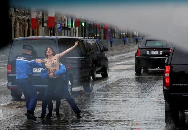 Photos &Video: Topless woman runs at President Trump