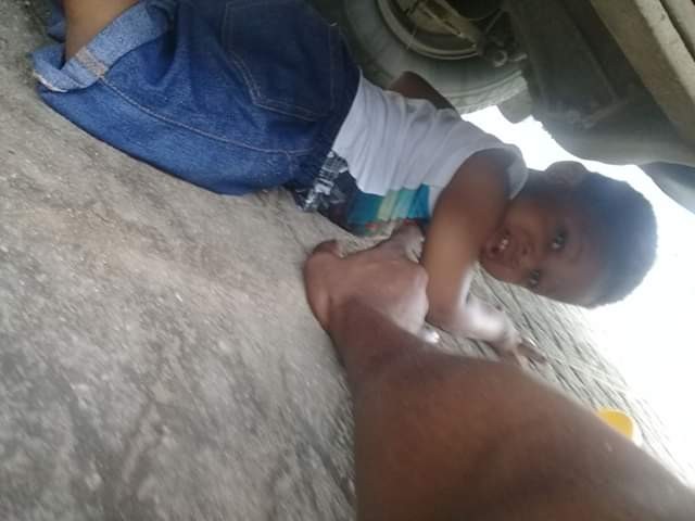 Photos: Nigerian man almost crushed his young son to death with his car
