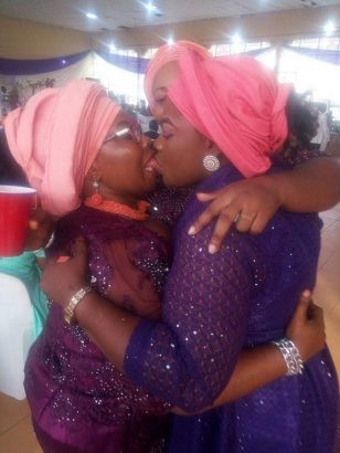 Viral photo of two Nigerian women publicly locking lips at a wedding this weekend