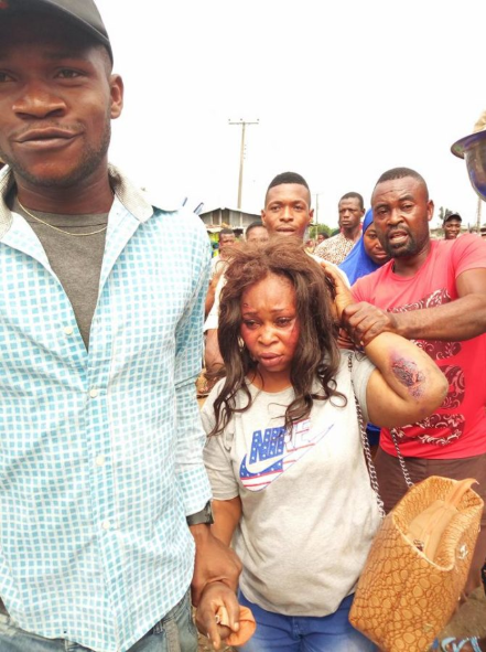 Suspected kidnapper is brutally beaten after she was allegedly caught trying to steal a 2-month-old baby (photos)