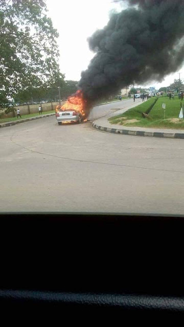 Photos: Young man drives car to Akwa Ibom House of Assembly complex, sets it on fire and flees