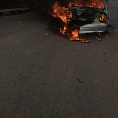 Photos: Young man drives car to Akwa Ibom House of Assembly complex, sets it on fire and flees