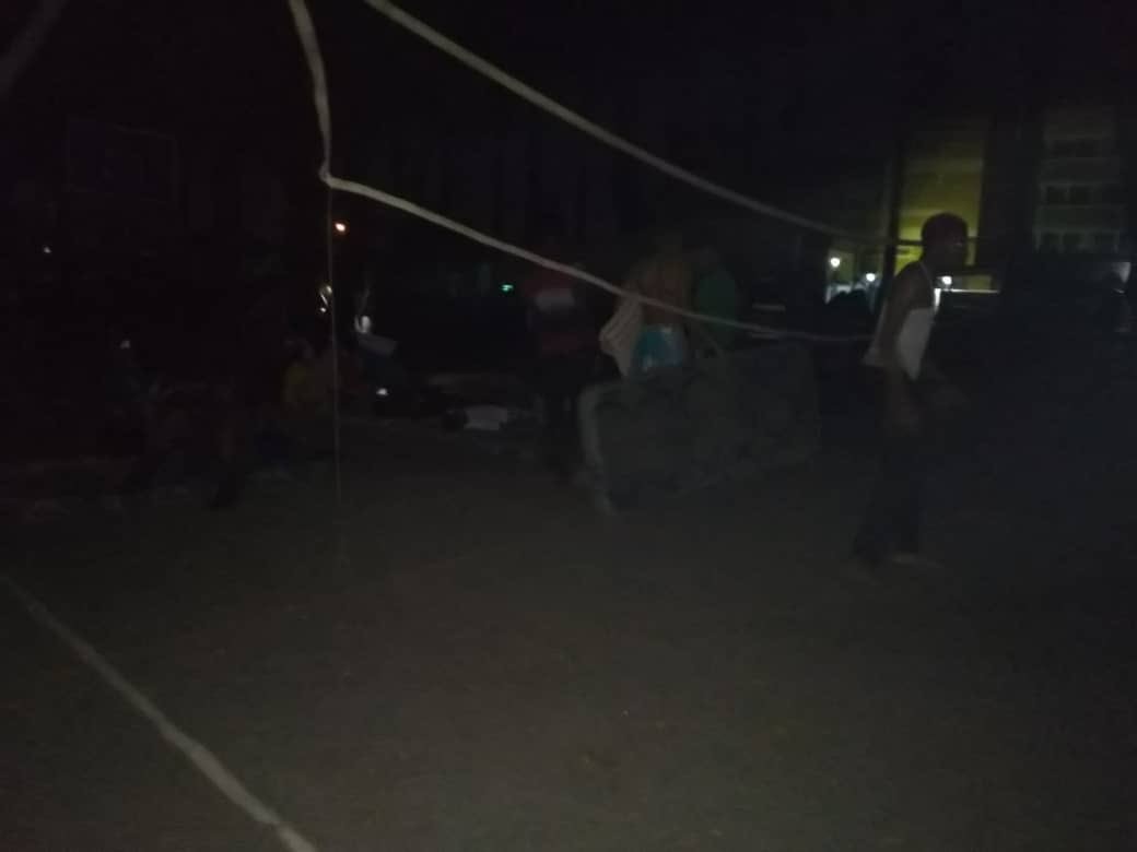 Photos: University of Lagos medical students sleep on the road due to power outage in their hostels