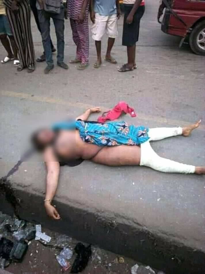 Graphic: Unidentified woman murdered in Onitsha; pigeon and coins found on her corpse