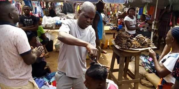 Photos: Outrage as youths storm market in Gboko, Benue and forcefully shaved young men with