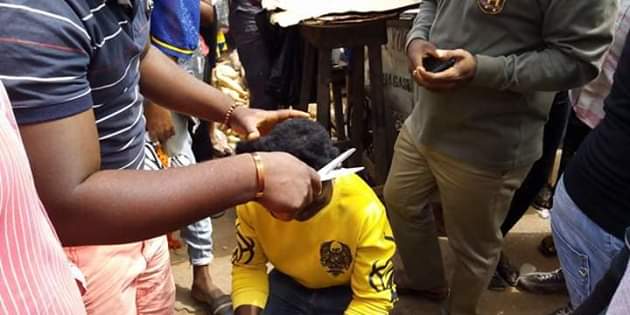 Photos: Outrage as youths storm market in Gboko, Benue and forcefully shaved young men with