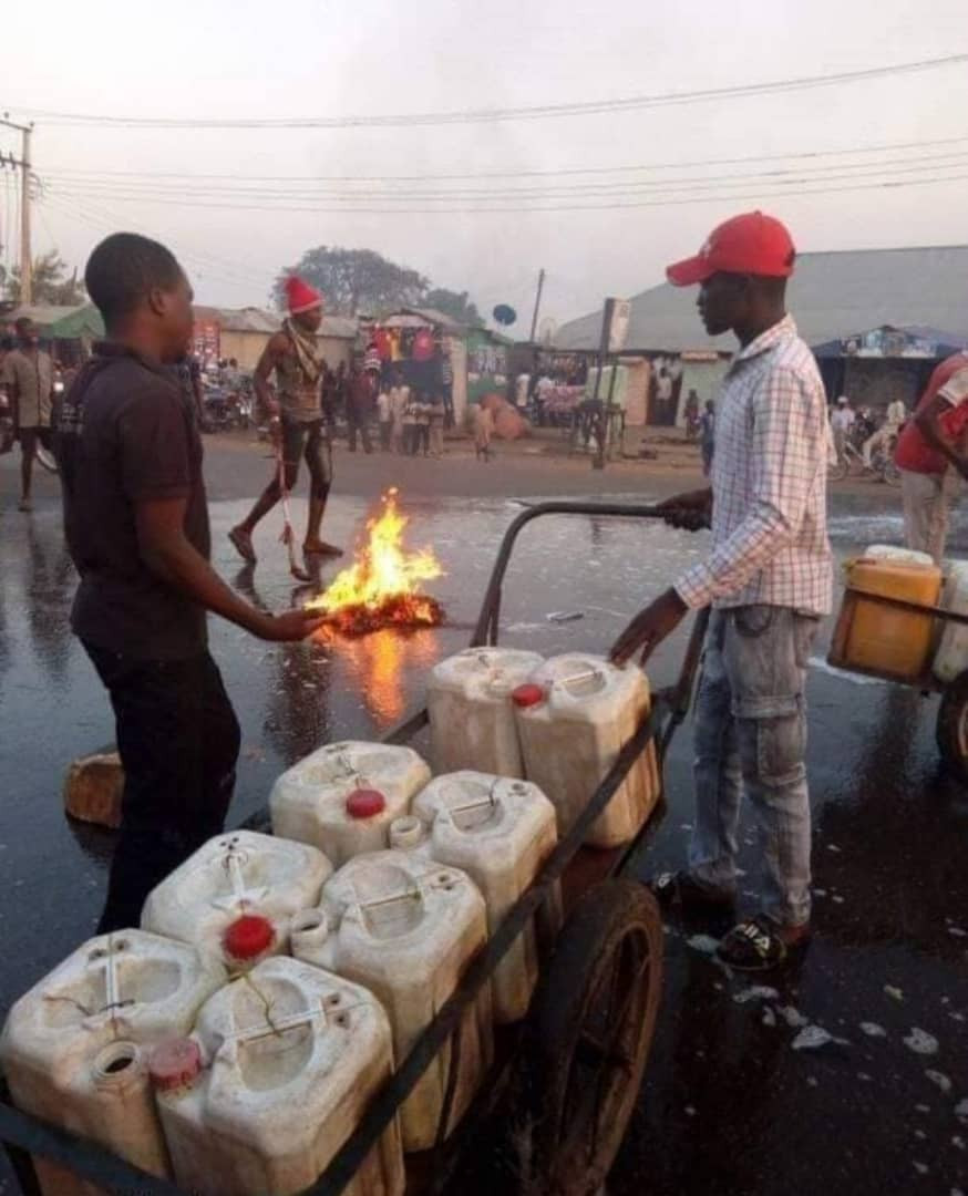 Photos: Kaduna state residents wash their streets with soap and water shortly after Governor El-Rufai