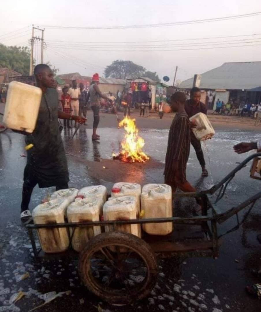 Photos: Kaduna state residents wash their streets with soap and water shortly after Governor El-Rufai