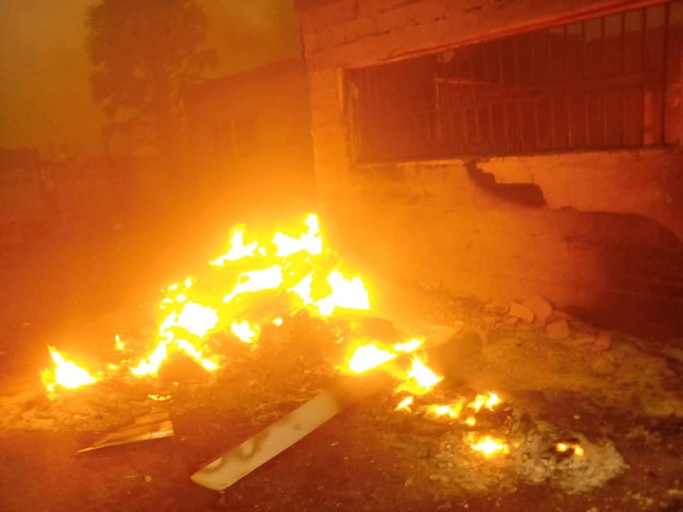 Photos: INEC office in Plateau set ablaze by drunk security officer, PVCs and other items burnt