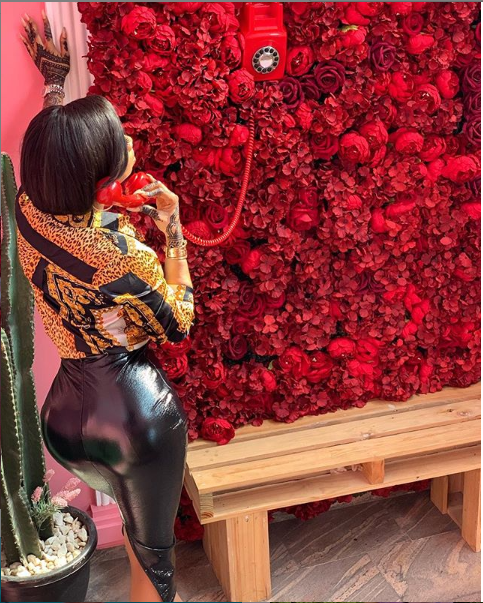 Toke Makinwa flaunts her curvy backside in Latex skirt and Versace shirt (Photos)