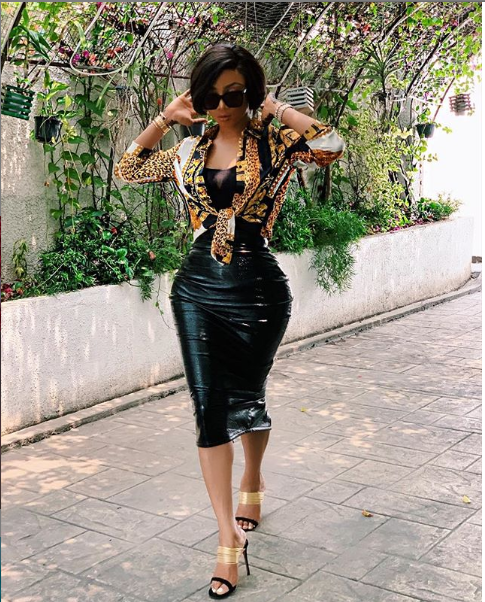 Toke Makinwa flaunts her curvy backside in Latex skirt and Versace shirt (Photos)