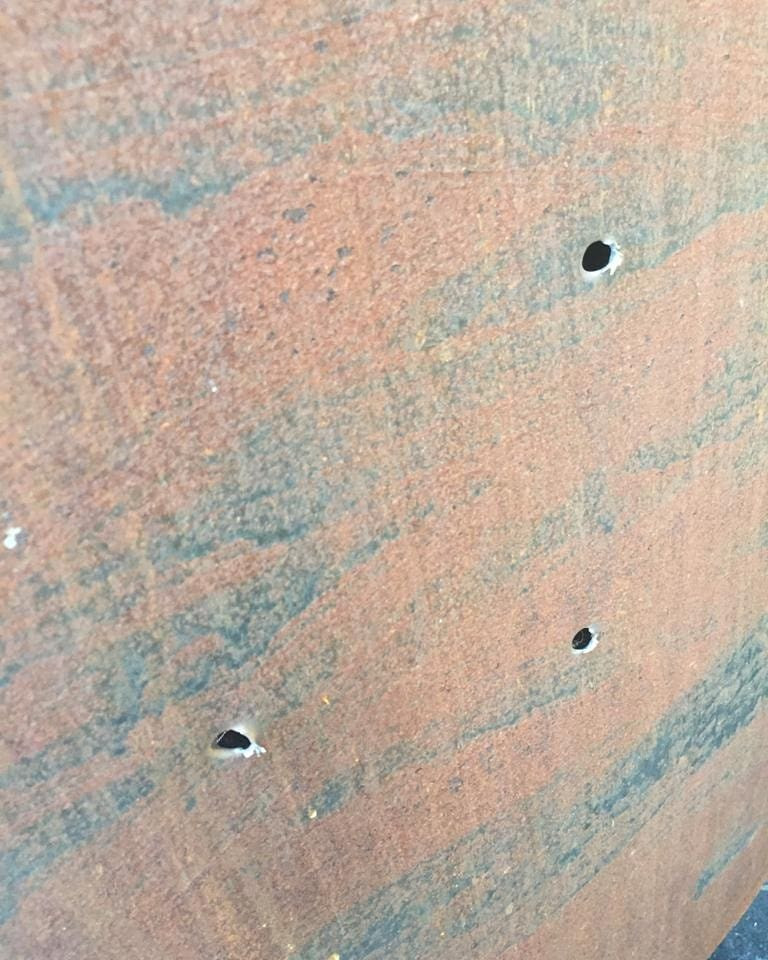 Photos of bloodstains and bullet holes from the 