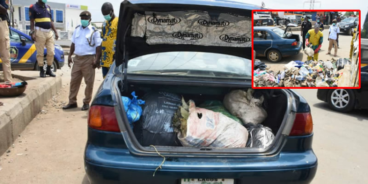dumping refuse on the median in Ejigbo LCDA.