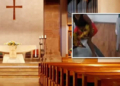 Woman urinates on church altar