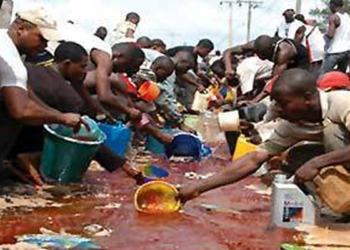 Residents scooping PMS in Lagos