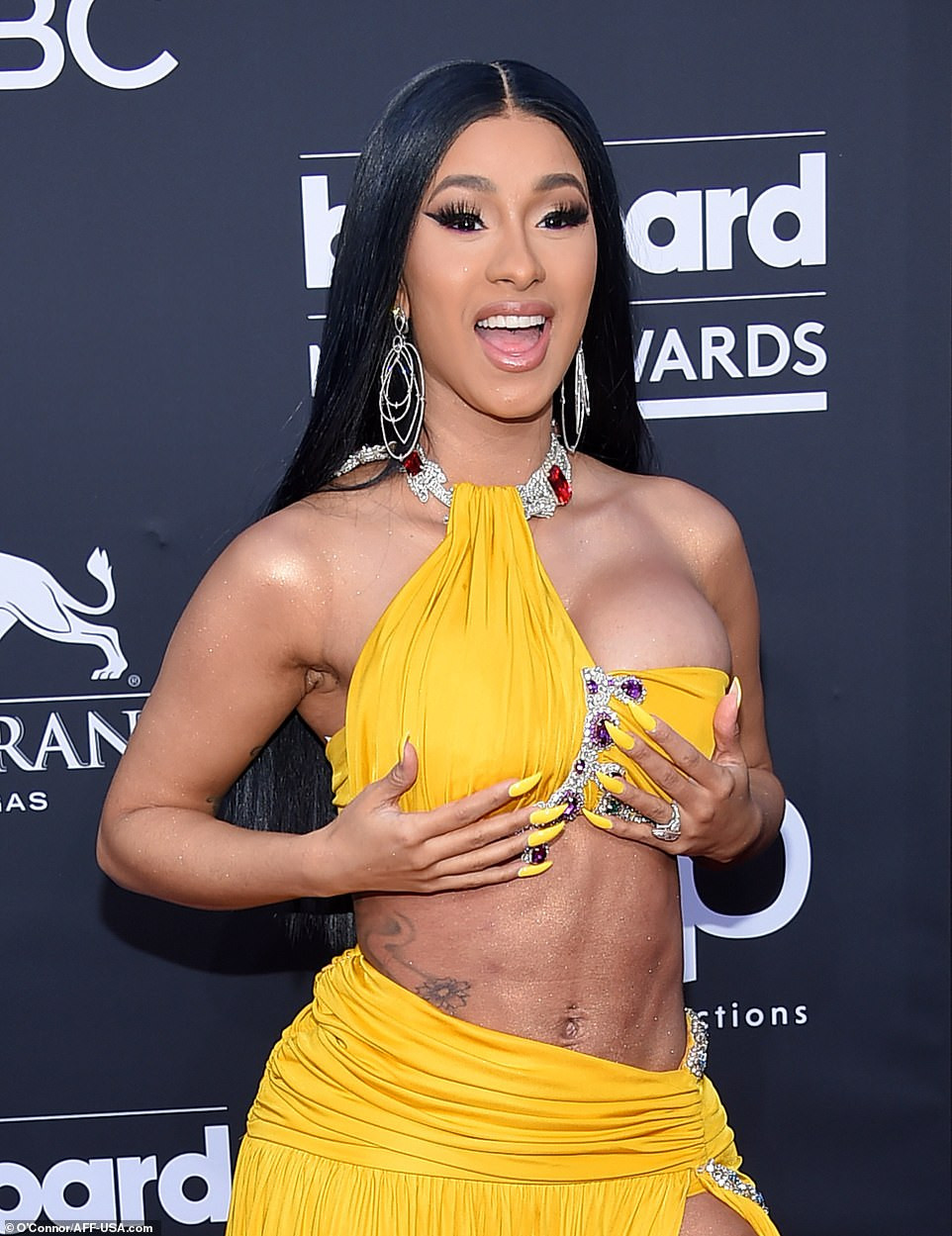Cardi B nearly exposes her private part as lifts her leg while posing with?...
