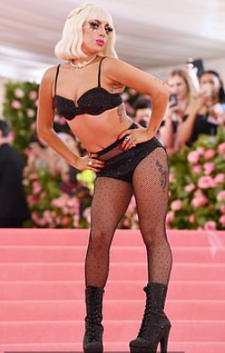 Lady Gaga wore four outfits to the Met Gala, stripping each outfit off to reveal the next before ending with a risque lingerie