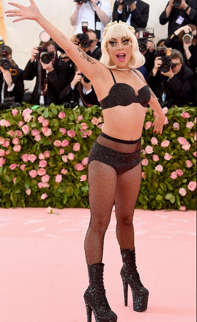Lady Gaga wore four outfits to the Met Gala, stripping each outfit off to reveal the next before ending with a risque lingerie
