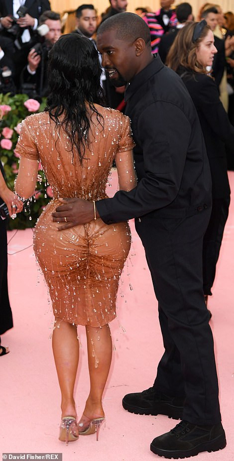 Kim Kardashian puts her curves on display as she arrives the Met Gala in figure-hugging Maison Mugler gown