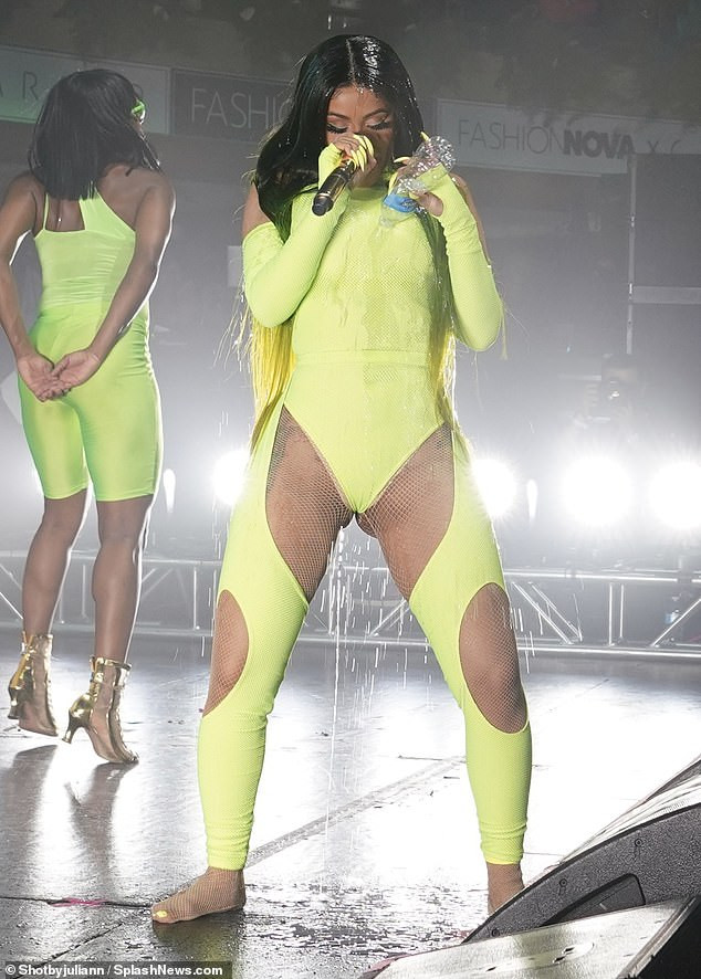 Cardi B flaunts her curves in eye-catching thong bodysuit as she performs on stage (Photos)