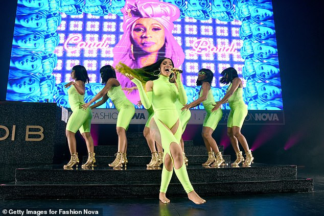 Cardi B flaunts her curves in eye-catching thong bodysuit as she performs on stage (Photos)