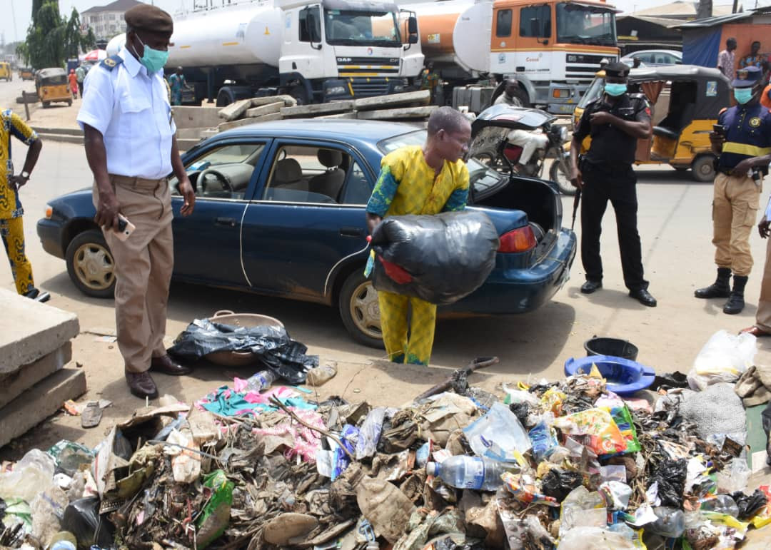 Photos: See what police did to a man caught dumping refuse on the streets of Lagos