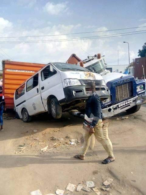 Photos: 40 feet container crushes two vehicles loading passengers in Ihiala