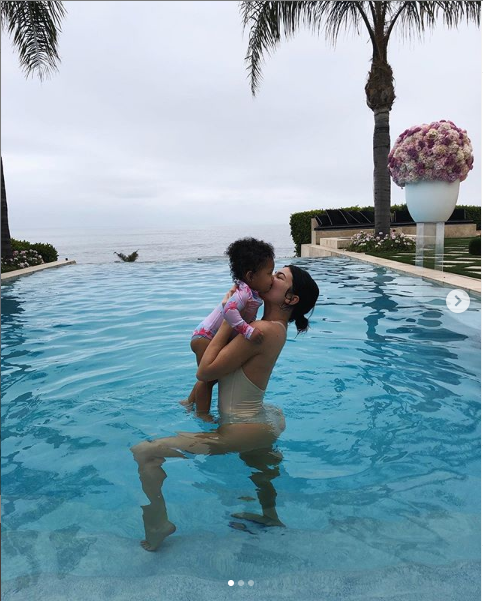 Cute new photos of Kylie Jenner & her one-year-old daughter Stormi splashing around in the pool