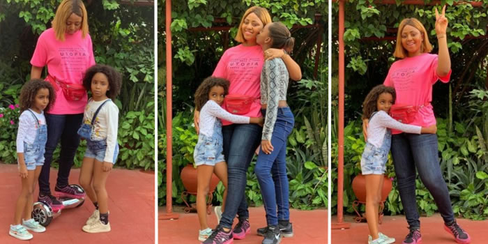 Regina Daniels poses with her step-daughters