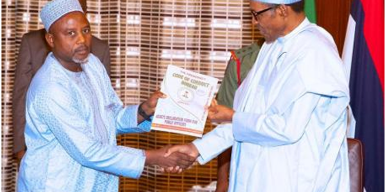 President Muhammadu Buhari being presented with Assets declaration form by the Chairman of Code of Conduct, Prof Mohammed Isah during an audience at the State House on 27 May. Photo State House