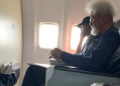 Wole Soyinka and the disrespectful young man in face cap.