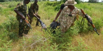 A Boko Haram terrorist retrieved from the bush by Nigerian troops.